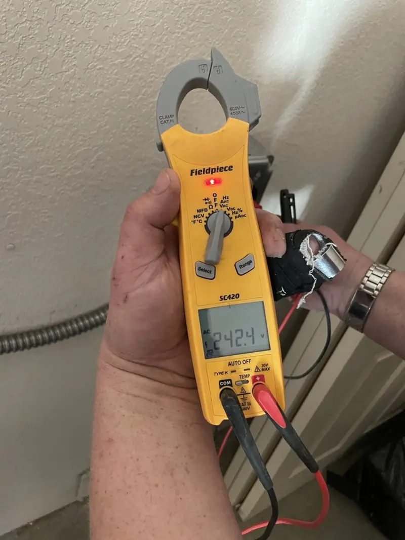 Voltage testing with clamp meter during Recessed Lighting Installation in Hales Corners